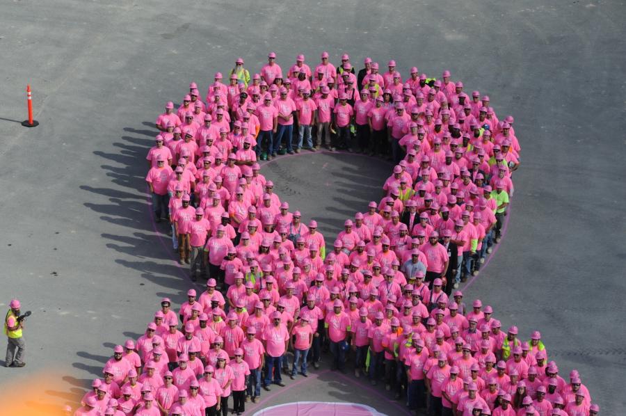 Employees from EMCOR/Poole and Kent Corp., along with those of its clients, Bayhealth and The Whiting-Turner Contracting Company, and other workers on site, put on EMCOR Pink Hard Hats as they formed EMCOR's giant human pink hard hat ribbon at Bayhealth's new Sussex Campus construction site in Milford, Del.