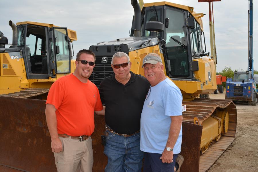 The Wilkins family was out in force at the Lyon auction in Fort Worth. (L-R): Jeremy, Roger and Dale Wilkins of Wilkins Backhoe check out a John Deere 750K dozer. The contractors are located in Ardmore, Okla.