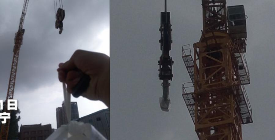 Instead of coming down to retrieve the bag, the crane operator lowered the hook and had the delivery man attach the bag of food.