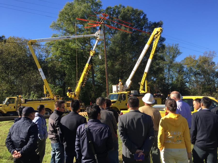 Delegates from several Chinese electric utilities observed best practices of live line work and distribution pole change out on a Rappahannock Electric Cooperative jobsite in Virginia.