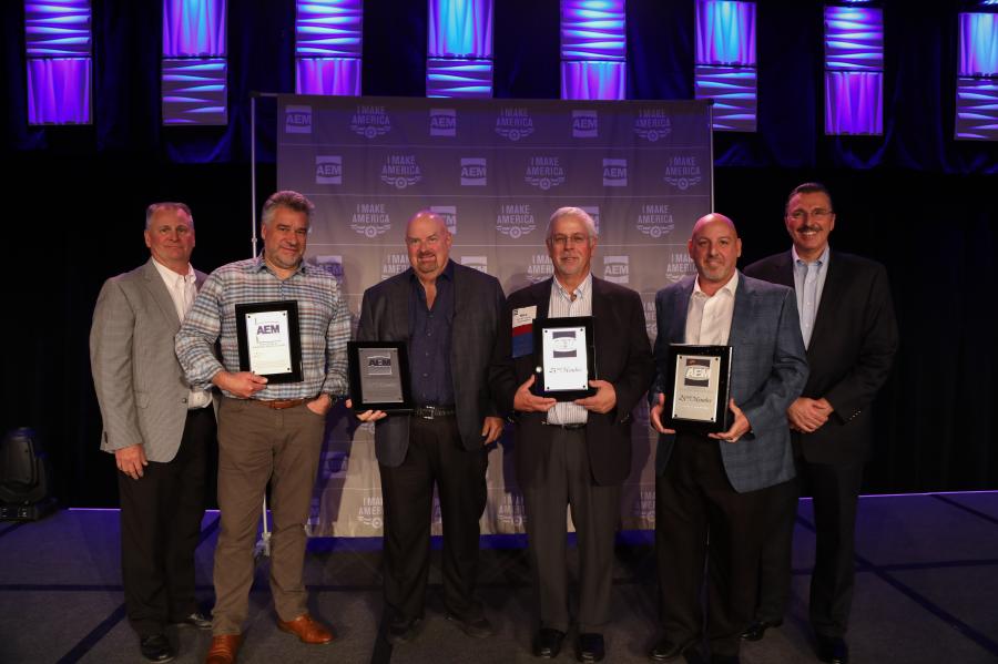 Receiving 25-year Milestone Member plaques at the 2017 AEM Annual Conference from 2017 AEM Chair Mike Haberman of Gradall (far L) and AEM President Dennis Slater (far R) were (L-R): Roger Adshead of Route One Publishing, Jeff Reed of VSS Macropaver/Reed International, Mike Osenga of Diesel Progress and Mike Devine of Asphalt Drum Mixers.