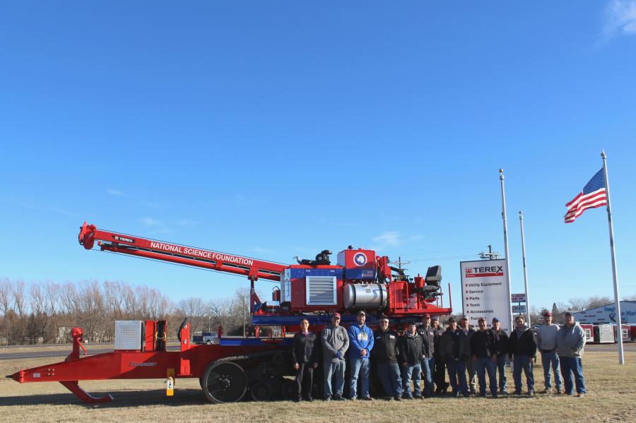 The Terex Utilities team from Watertown, S.D., responsible for building the A330 auger drill to meet the specific needs of the Antarctic Support Contract, stands with the unit prior to shipping it.
