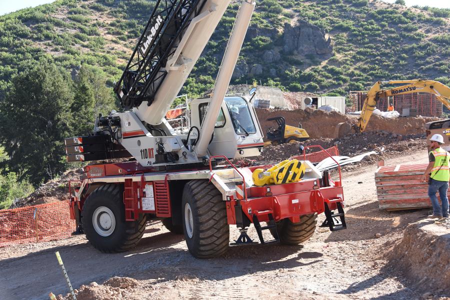 Construction on the mountain location requires crew on the ground to move around a lot of materials from a single delivery point on the job site.