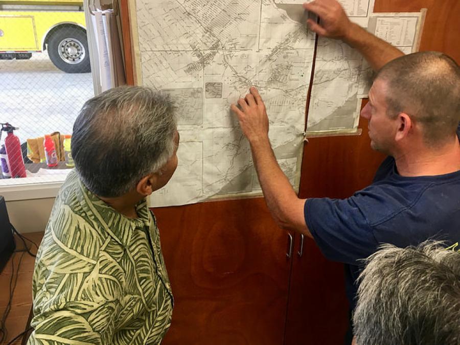 Hawaii Gov. David Ige [L) examining a map of volcano-damaged areas 
(Hawaii Governor's Office photo)