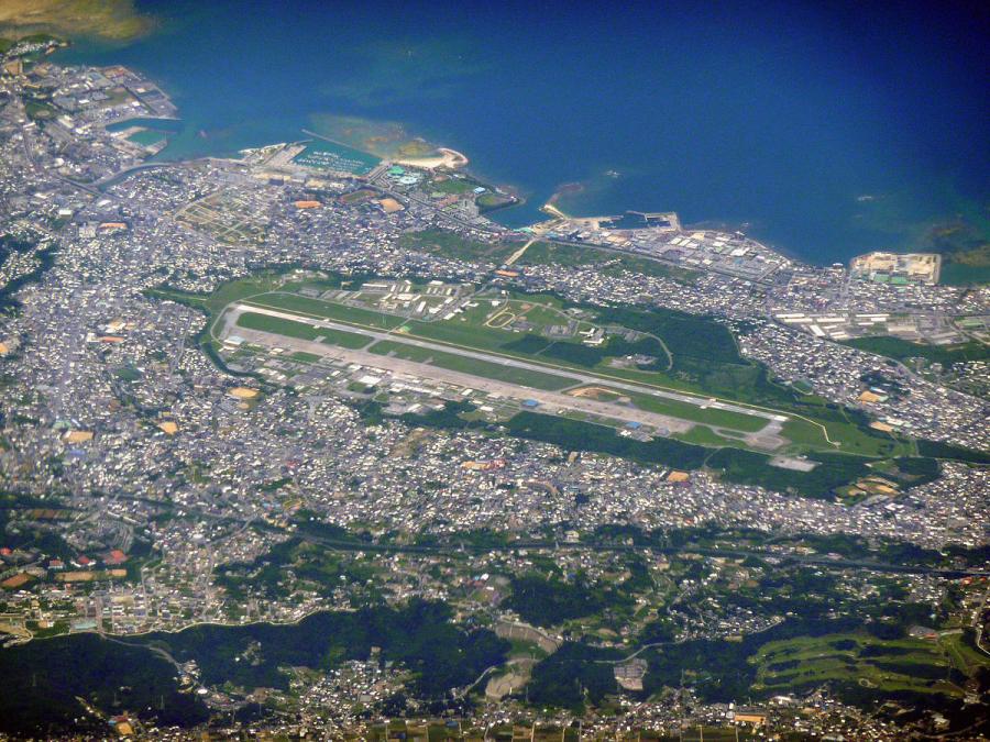 At the center of contention is a decades-old plan to move a Marine Corps air station from densely populated Futenma in the southern part of the island to less-crowded Henoko on the east coast.