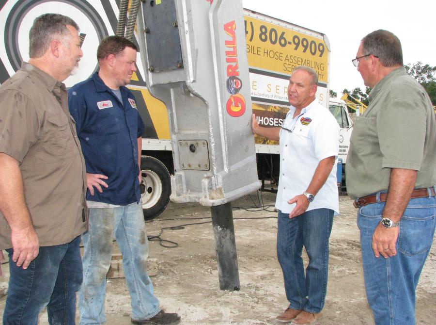 (L-R): As the installation wraps up, Dave Parker, Great Southern Equipment, Jacksonville, Fla.; Jason Sandborg and Bob Tedesco, both of Gorilla Hammers, Randolph, Mass.; and David Dostie, United Bros. Development Corp., Jacksonville, Fla., discuss maintenance schedules for the hammer.