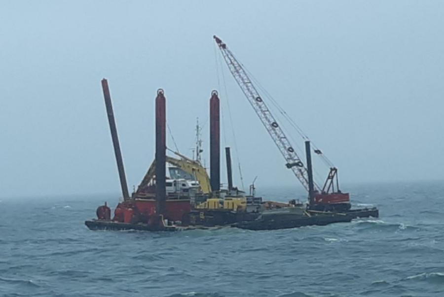 The barge, which was heading to a dredging project site, was carrying construction equipment that cumulatively held a maximum of 500 gallons of diesel fuel and 400 gallons of hydraulic oil (Coast Guard photo)