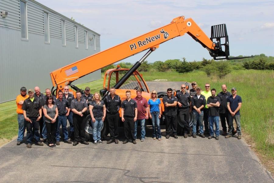 The Palmer Johnson staff gets together for a photo in front of a reconditioned telehandler.