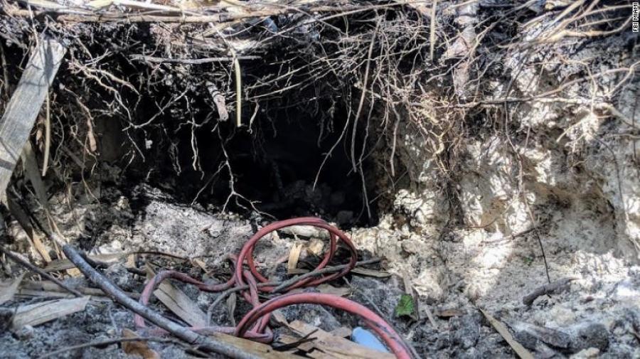 Investigators said the tunnel appeared to be dug by hand using tools such as a pickaxe, with a small wagon used to transport dirt and rock outside, Leverock said. A small ladder and a pair of muddy boots were also found inside. (Photo Credit: CNN)