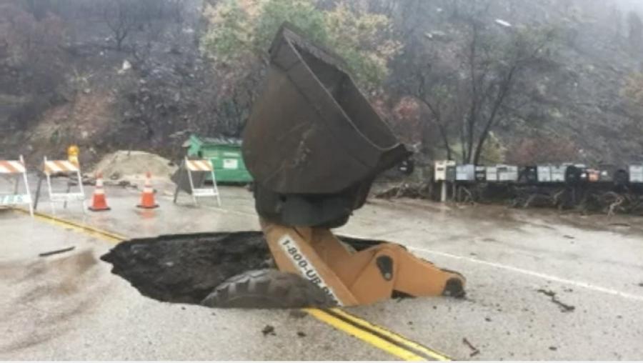 Crews were using construction equipment to clean up roads in the aftermath, when the sinkhole appeared and took the vehicle, the Ventura County Sheriff’s Department said.