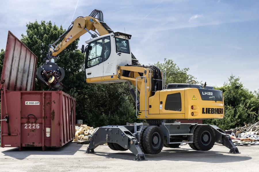 A Liebherr LH 22M material handler loading a container.