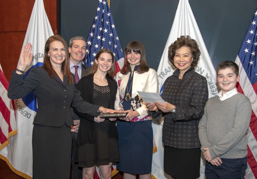 U.S. Secretary of Transportation Elaine L. Chao swears in Nicole R. Nason as Administrator for the Federal Highway Administration, with Nason’s husband David, and children Abby, Alex and Brady, in attendance. (Photo Credit: USDOT)