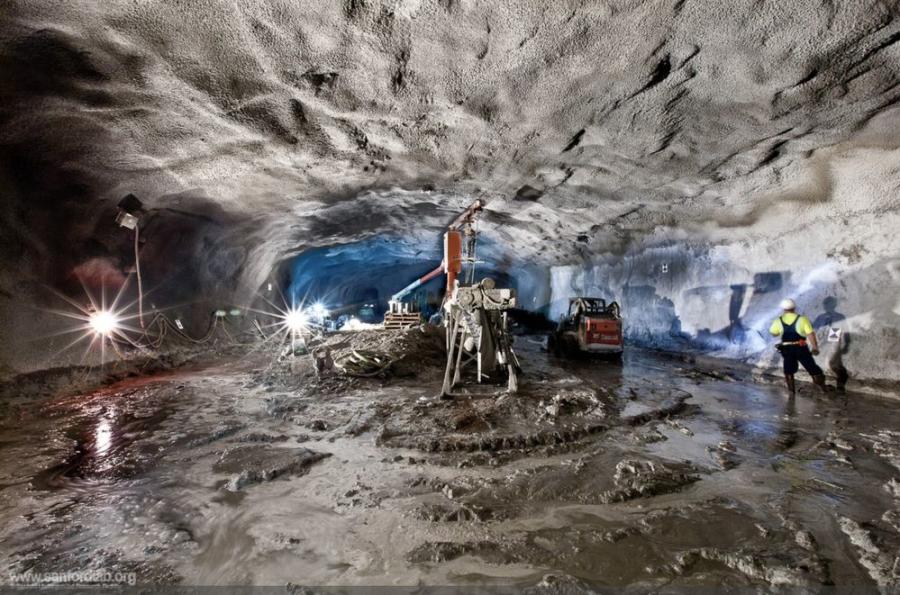 This cavern was built to house an experiment at the Sanford Underground Research Facility. It is seen here just after shotcrete was sprayed on the walls for ground support.
(Matthew Kapust Photo)