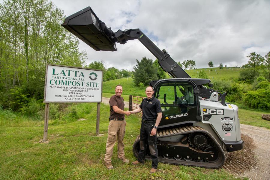 Chad Latta (L), of Latta Earthworks in Athens, Ohio is congratulated by JCB regional business manager Will Turner. Latta is the winner of the JCB “Win a Teleskid” Sweepstakes. He wins a 12-month lease on a JCB teleskid 3TS-8T compact track loader and $5,000 in cash.
