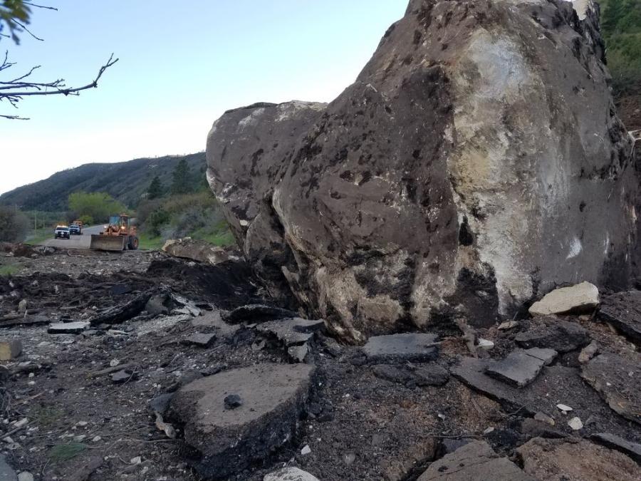 Workers drilled 15-ft.-deep holes into the rock to insert explosives before blasting it apart on May 26.
(CDOT photo)