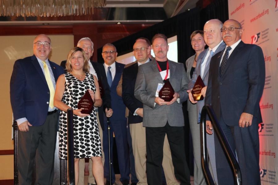 ARTBA Sr. VP of Safety & Education Brad Sant (L) and ARTBA Foundation Chairman Paul Yarossi (R) with TSID 40th Anniversary Award winners.