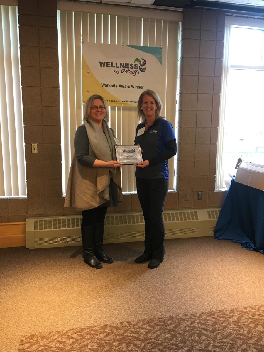 HR manager Sharon Hengel (L) and HR generalist Danette Smith accept the Wellness by Design Award.