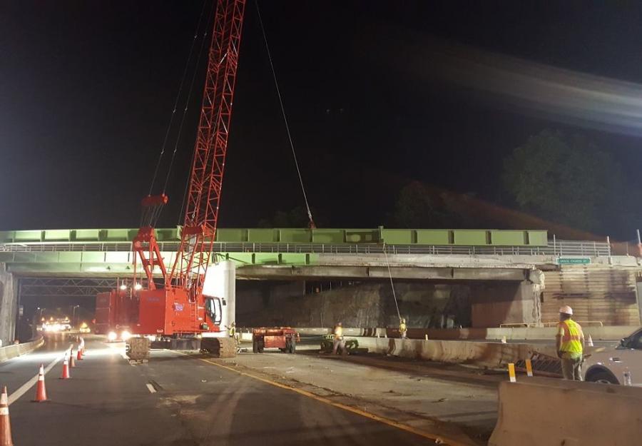 A Manitowoc 11000-1 crawler crane hoists a new steel bridge girder into place.
(New York State Thruway Authority photo)