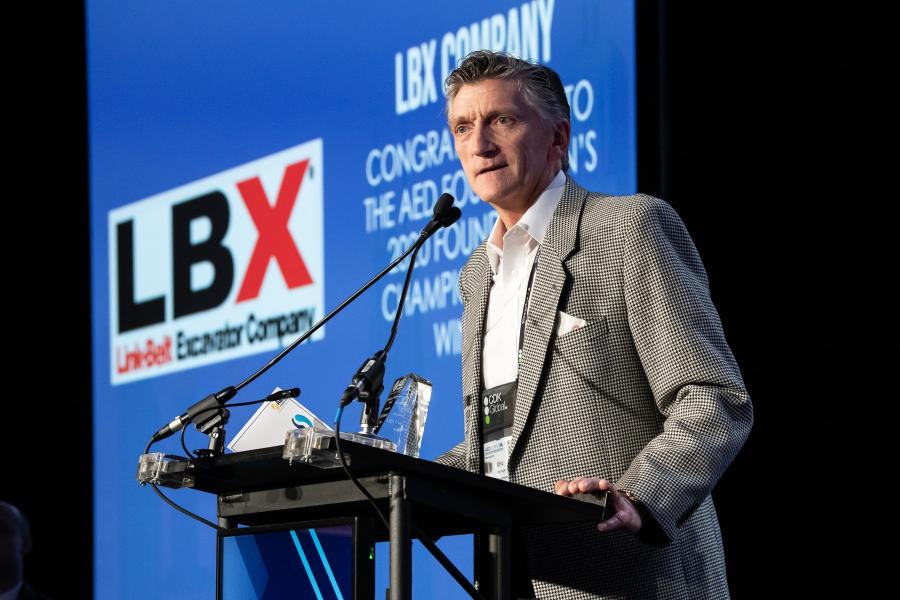 Eric Sauvage, president and CEO of LBX Company LLC, accepts the AED Foundation Champion Award.