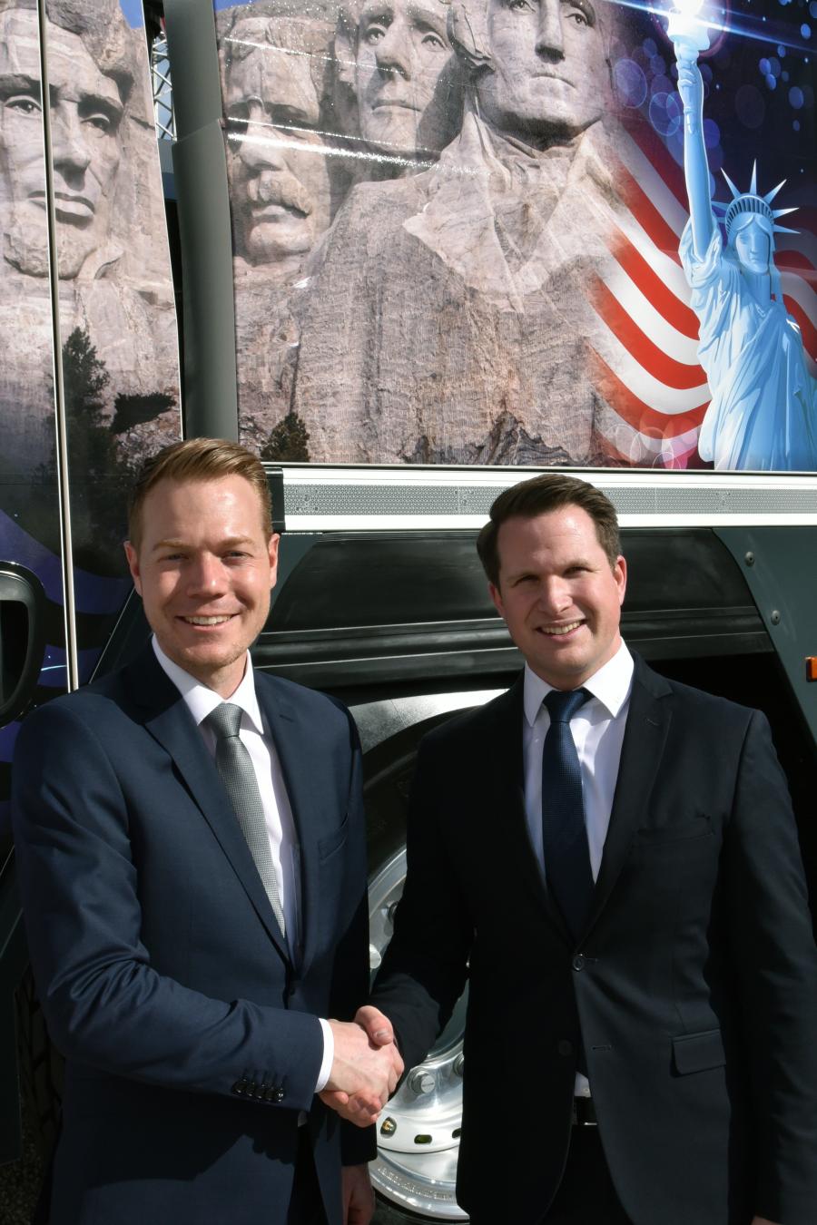 Daniel Pitzer (L) handing over the U.S. market responsibility for mobile cranes to Pierre Bilgeri.