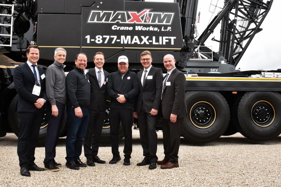 Liebherr USA Co. and the leadership of Maxim Crane Works following the handover of an LTM 1650-8.1 mobile crane on the first day of ConExpo 2020.