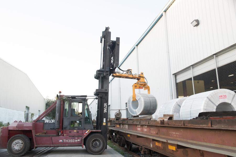 MiTek receives the steel coils in batches of six or seven aboard each rail car.