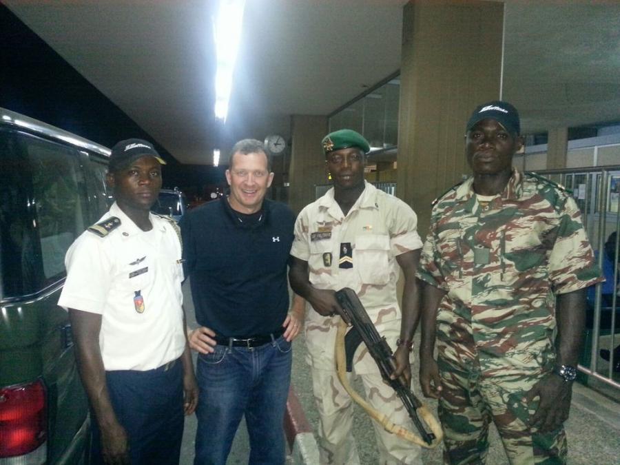 One of Hoffman’s biggest ever export deals delivered 170 pieces of equipment to the Cameroon Corps of Engineers. Here, Hoffman president, Tim Watters, is being escorted to a construction site by a Corps of Engineers guard detail. Note the honorary Hoffman employee status evidenced by their hats.