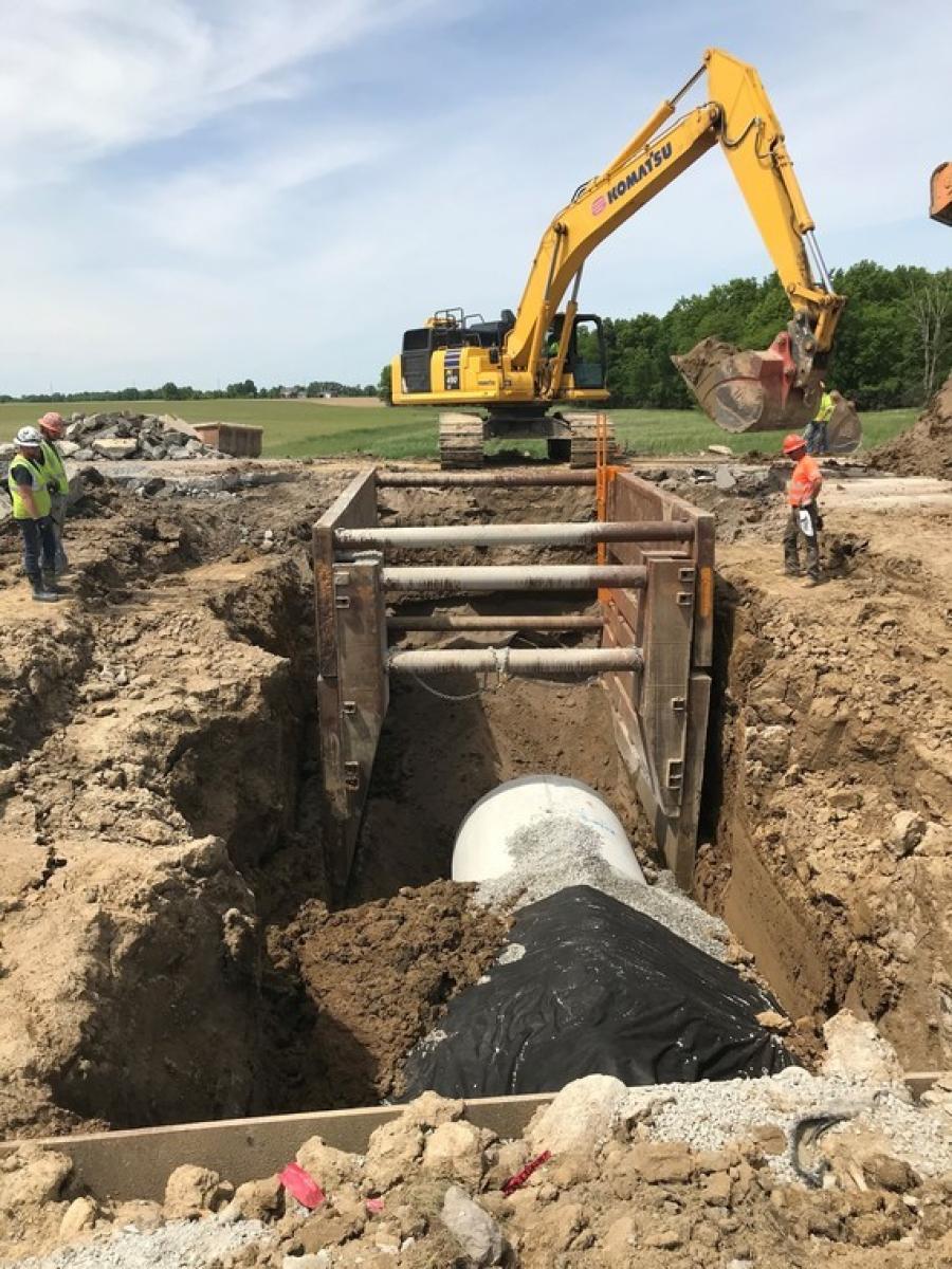 Crews place reinforced concrete pipe under the westbound lanes of U.S. 30 just east of Upper Sandusky 
for an emergency culvert 
replacement project.
(Ohio Department of Transportation photo)