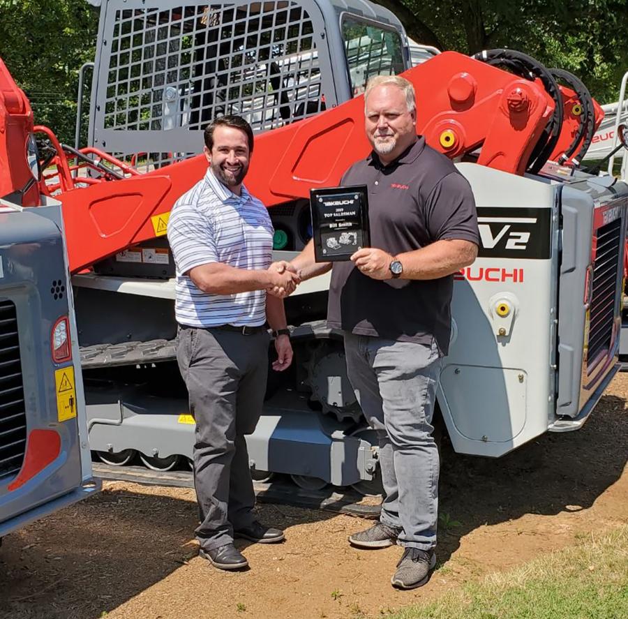Steve DePriest (L), Takeuchi southeast region business manager, and Bill Smith, Cobb County Tractor sales representative.