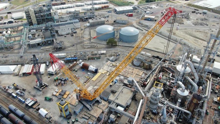 The Demag CC 6800-1 crawler had to be positioned far away from the 20-ft. (6.1-m) diameter, 40-ft. (12.2-m) tall vessels. Superior Cranes' crew used a 300-ton (275-t) crawler assist crane to build out the CC 6800-1.