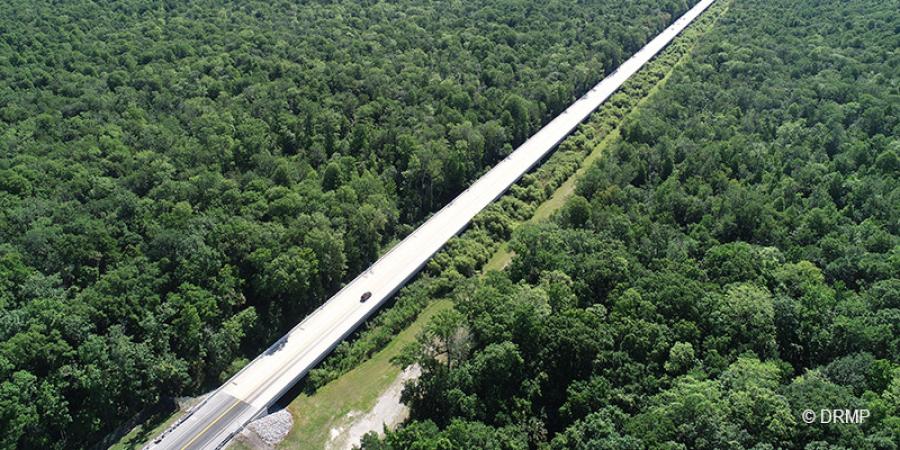 The project involves widening the expressway from two to four lanes for approximately 7 mi., construction of a 6,500-ft.-long bridge parallel to a bridge built in 2015, two toll gantries, two bridges over local roads, and more than 6,000 linear ft. (1,829 m) of noise wall.