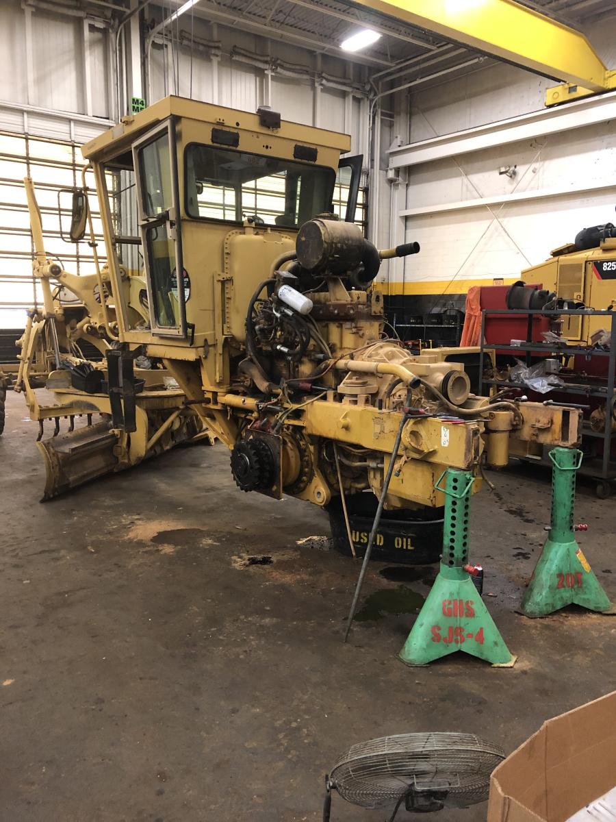 The rebuilt 12H motor grader is a 1998 model with approximately 13,000 hours on the machine.