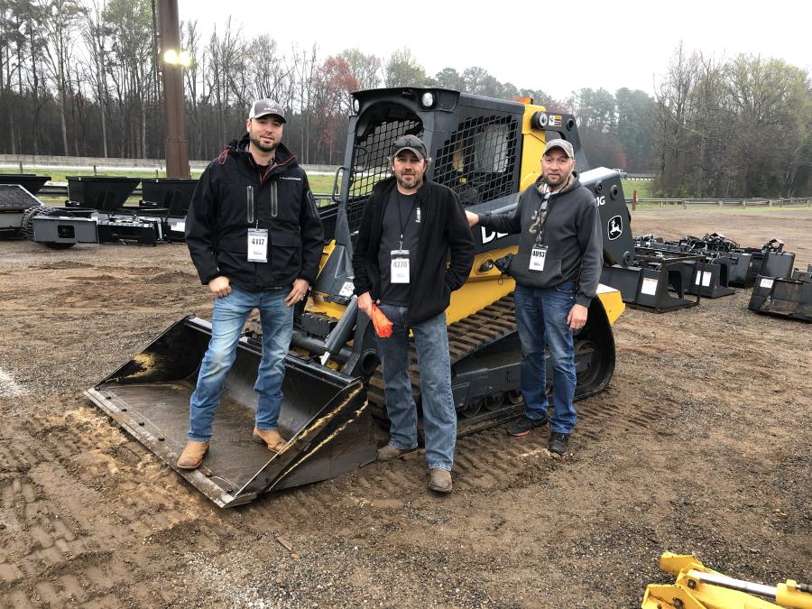 (L-R): Looking over this John Deere 331 compact track loader are Justin and Cecil Rowland, and Tim Lawrence of All American Transport in Spartanburg, S.C.
