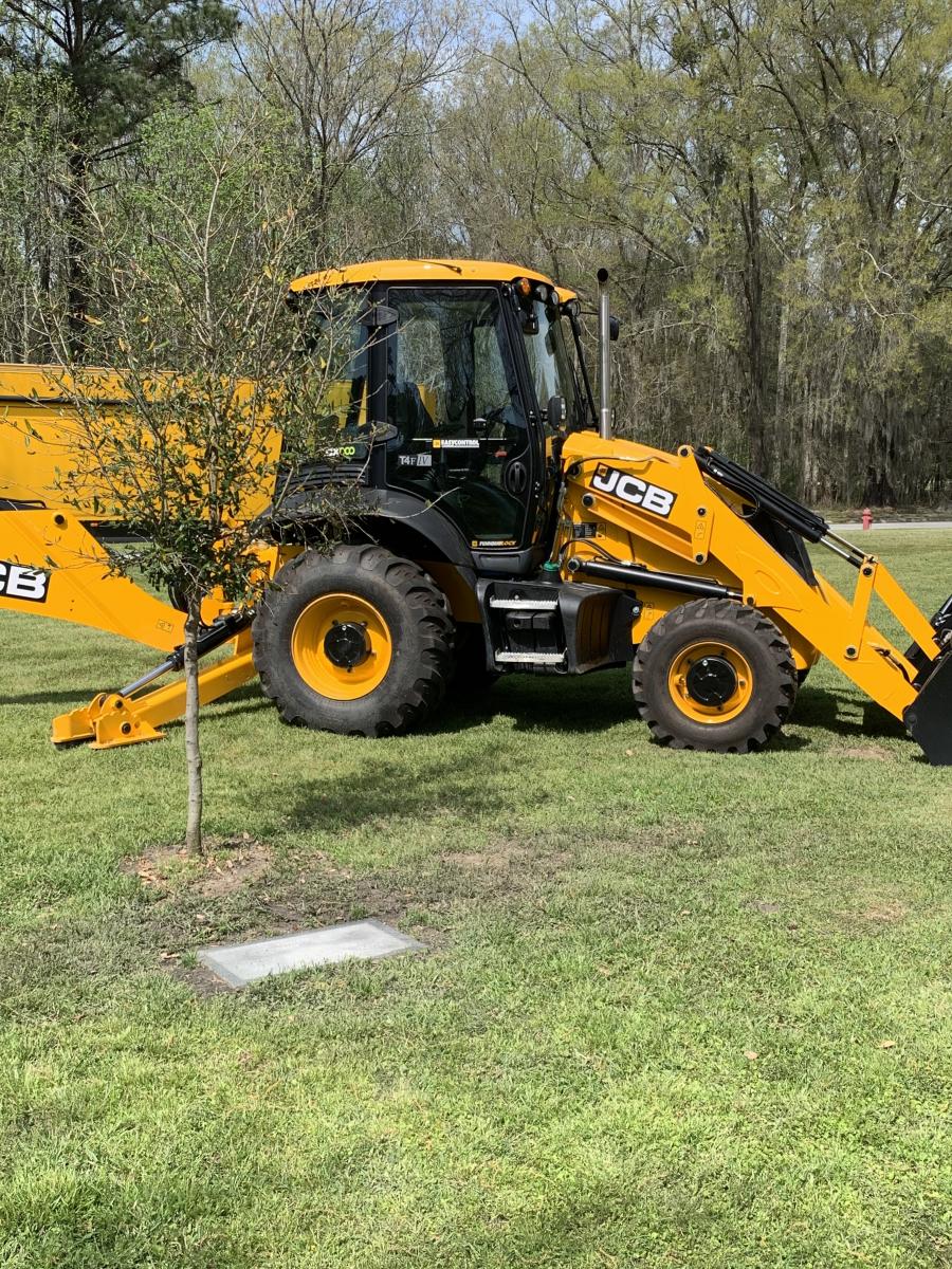 JCB recently planted a cathedral oak tree and placed a plaque commemorating Donny Wild's years of service on its property in Savannah, Ga.
