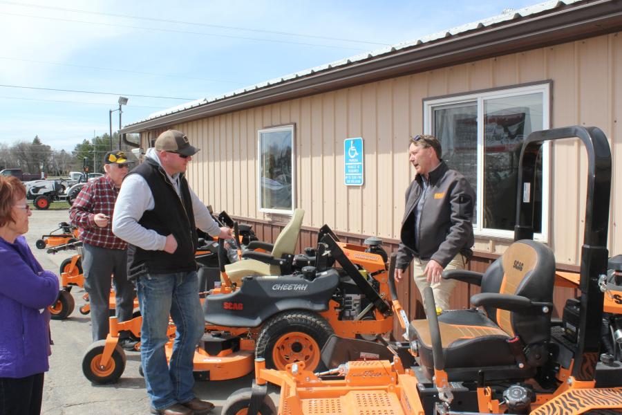 Shawn Larson (L) of Little Falls, Minn., looks at the new Scag Turf Tiger 61-in. with a 37 EFI Briggs Vanguard motor. “It is a great heavy-duty mower for large properties or commercial mower business needs,” said Jeff Meyer, Scag Mowers’ Midwest product specialist.
