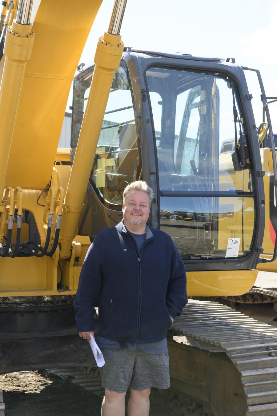 Ryan Geddes of Premiere Industries, Thomaston, Conn., with a 2004 John Deere 225CLC hydraulic excavator.