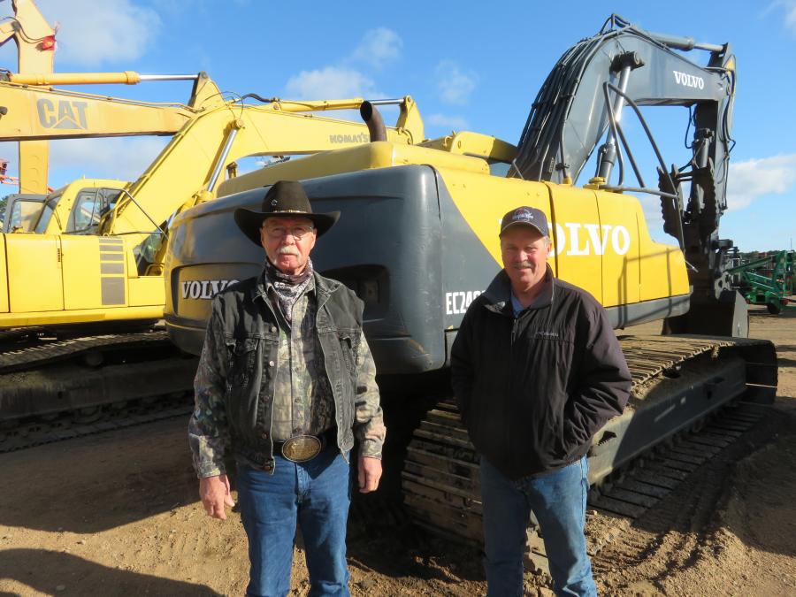 Hoping to place the winning bid on this Volvo EC240CLC excavator are Bob Johnas (L) of Johnas Track and Equipment, Medford, Wis., and his brother, John. 
