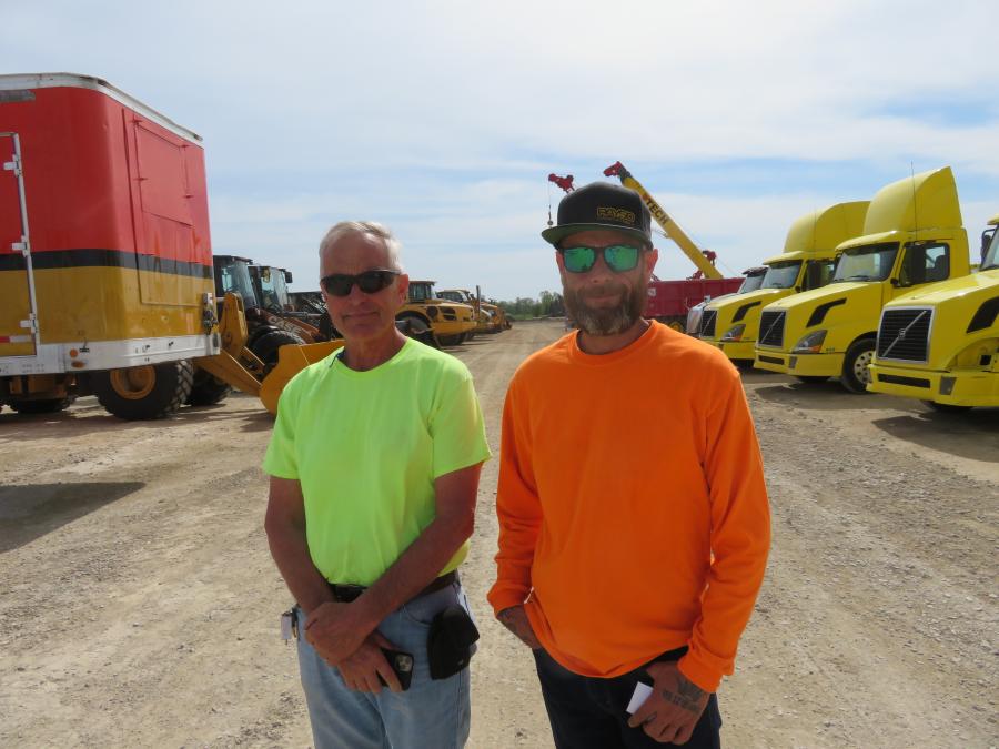 Dick (L) and Tim Day of DK Contractors head over to look at the late-model Case wheel loaders.
