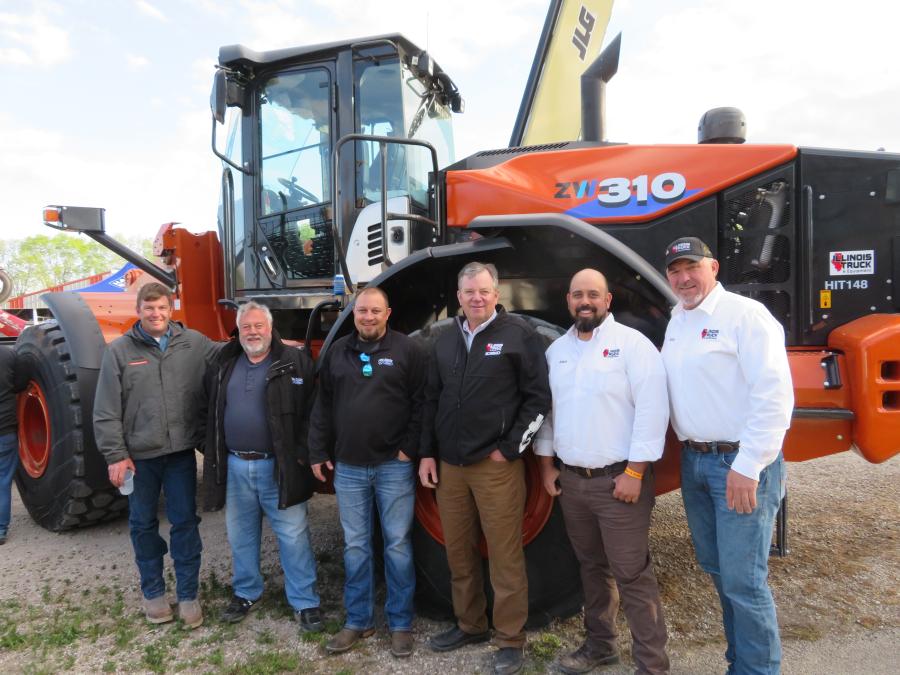 In front of the Hitachi ZW310 wheel loader (L-R) are Nick Stipanovich, Illinois Truck & Equipment; Rick and Ricky Baker, both of Rod Baker Ford; Rolf Helland, president of Illinois Truck & Equipment; Adam Salinas, general manager of Illinois Truck & Equipment; and Kenny Bell, inside sales, Illinois Truck & Equipment.
