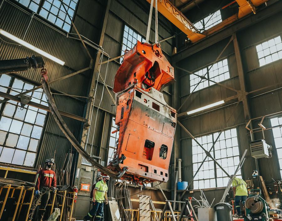 This drill rig has been disassembled to prepare it for delivery to the LBNF work area a mile underground. Prior to lowering any large piece of equipment, crews perform a test sling to understand how to rig the piece so it hangs properly while traveling through the shaft.
(Adam Gomez, Sanford Underground Research Facility photo)