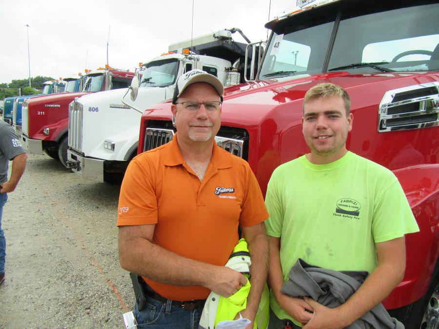 Fabrizi Trucking and Paving’s Emil Fabrizi (L) and son, Emilio, take in the auction activities.
