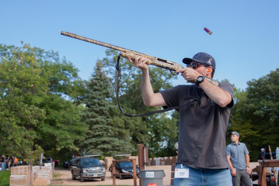 A shooter takes aim at the AGC of Minnesota’s Sporting Clays event.