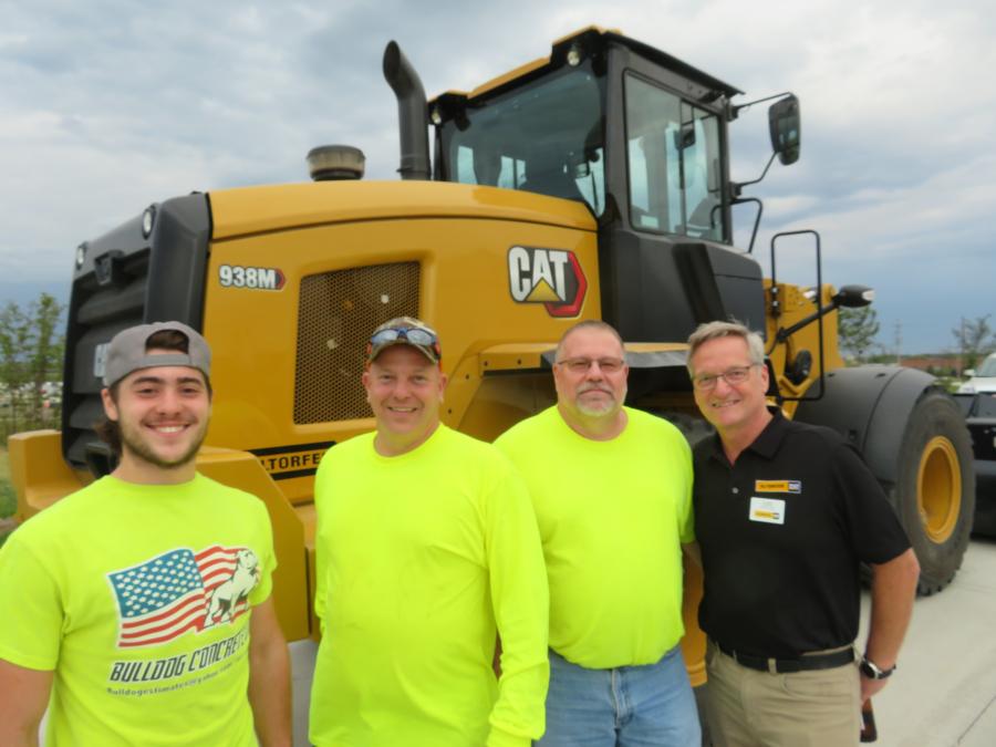 Bulldog Concrete LLC just purchased this Cat 938M wheel loader at the open house. From Bulldog Concrete (L-R) are Nick, Joe and Art Krueger and from Altorfer CAT is Lou Nistler. Bulldog also purchased a Cat 272D3 XE skid steer.
