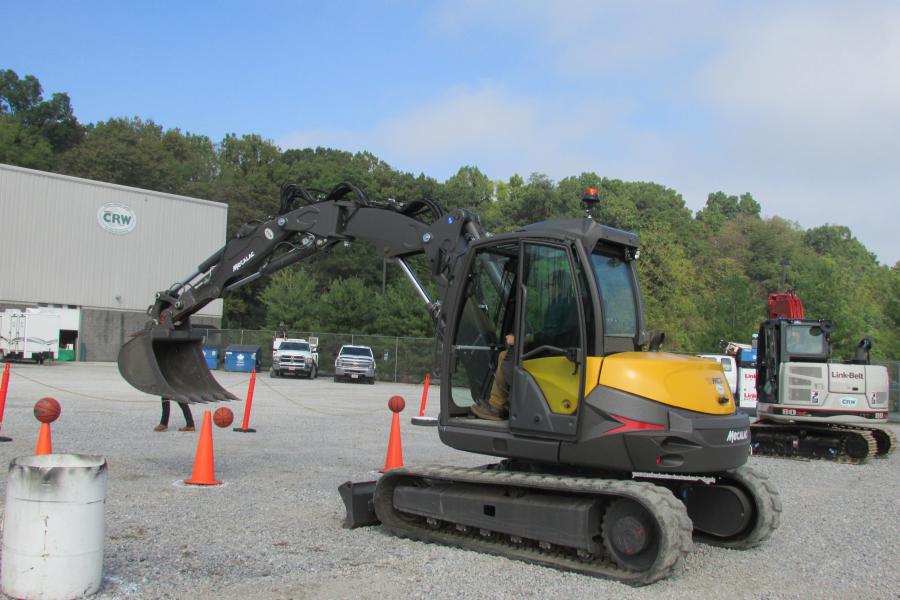 Guests could participate in a basketball challenge using a Mecalac 10MCR crawler skid-excavator.