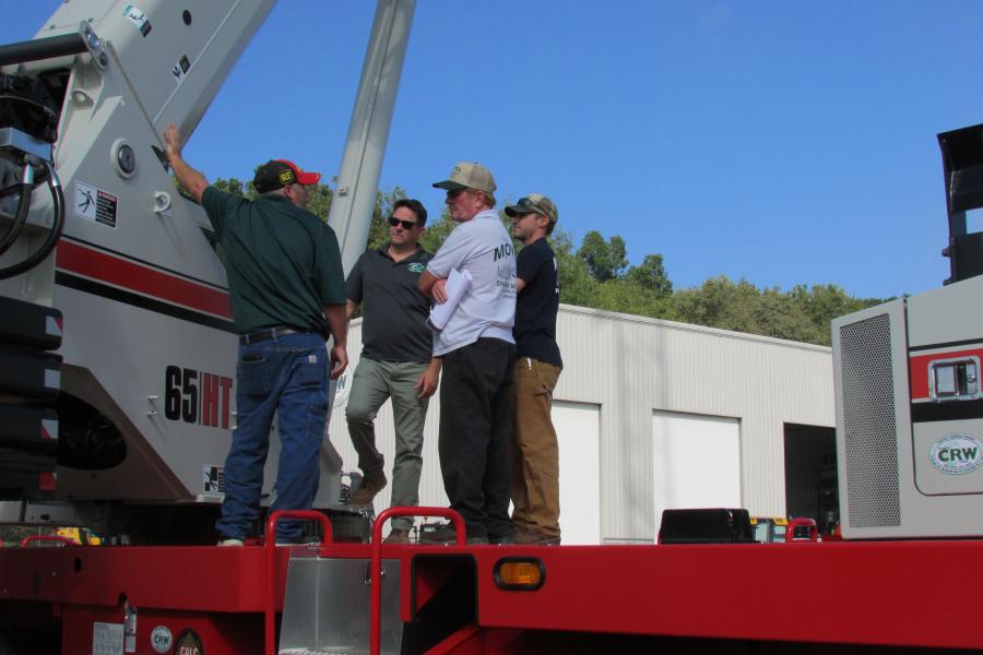 Representatives from Moyer Crane Service in Laurelton, Pa., check out the all new Link-Belt 65HT truck crane during the event.