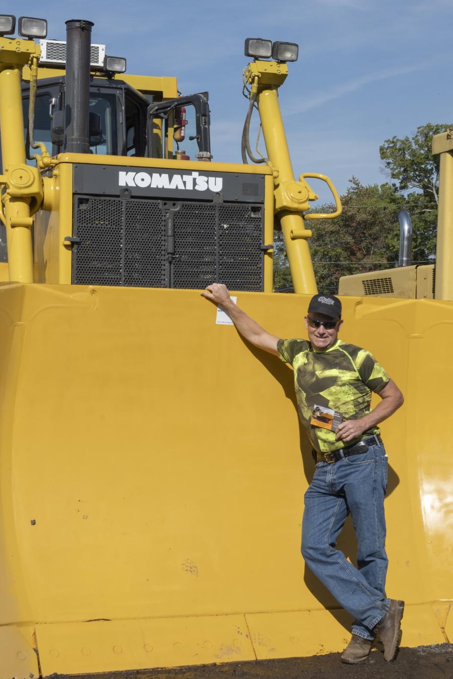 Kirk Chellstorp of Full Spectrum Industrial Coating in Stafford Spring, Conn., stands in front of a 2007 Komatsu WA450-1 wheel loader.