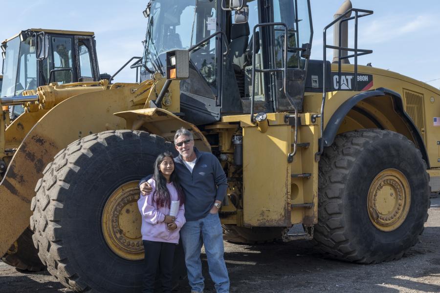Stefania (L) and Nick Mancini of NJR Construction in Torrington, Conn., with a 2008 Caterpillar 980H wheel loader.