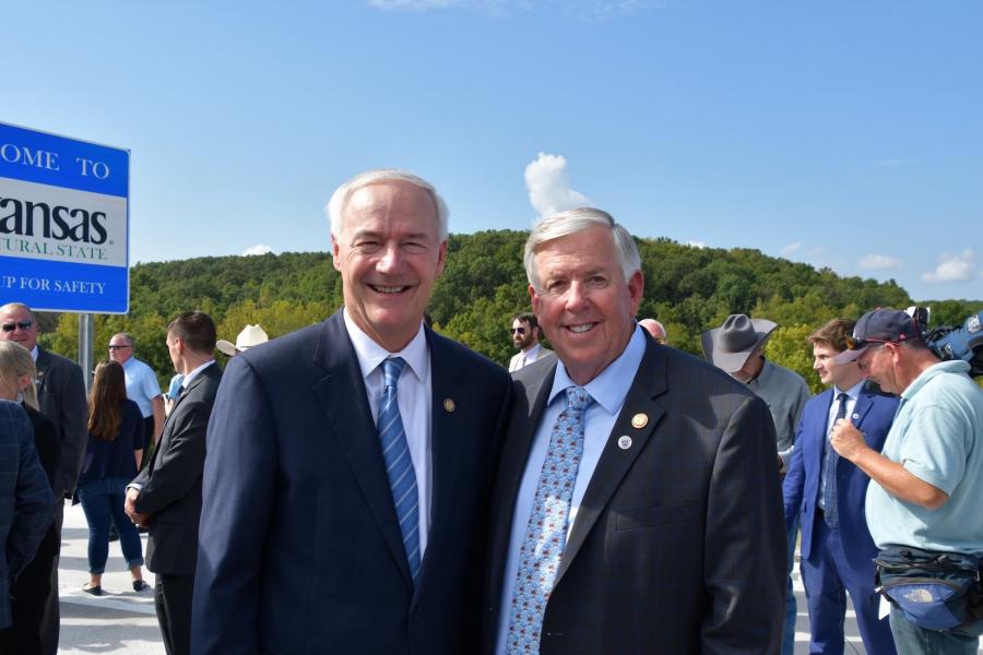 Missouri Gov. Mike Parson (L) and Arkansas Gov. Asa Hutchinson joined together at the Missouri-Arkansas state line for a ribbon cutting ceremony to celebrate the completion of the I-49 Missouri-Arkansas Connector.