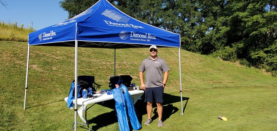 Tony Fiorentini is at the Dimond Bros. Insurance challenge hole tent.