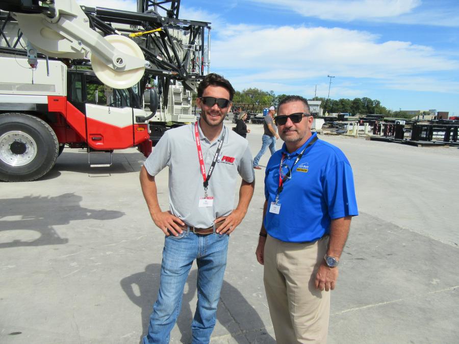 Ed Protesto (L) of Pro Crane Rigging and Kelly Tractor Company’s Hugo Verez take in the cranes on display at Link-Belt’s 2021 CraneFest.